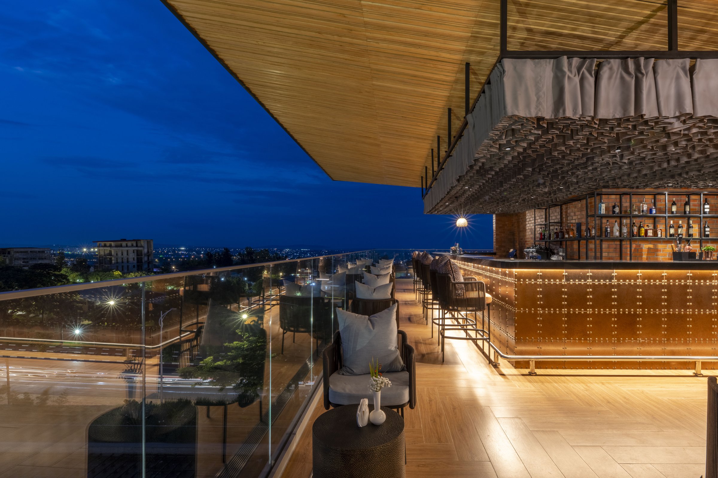The Jaro rooftop lounge at Zaria Court Kigali at dusk, overlooking the city