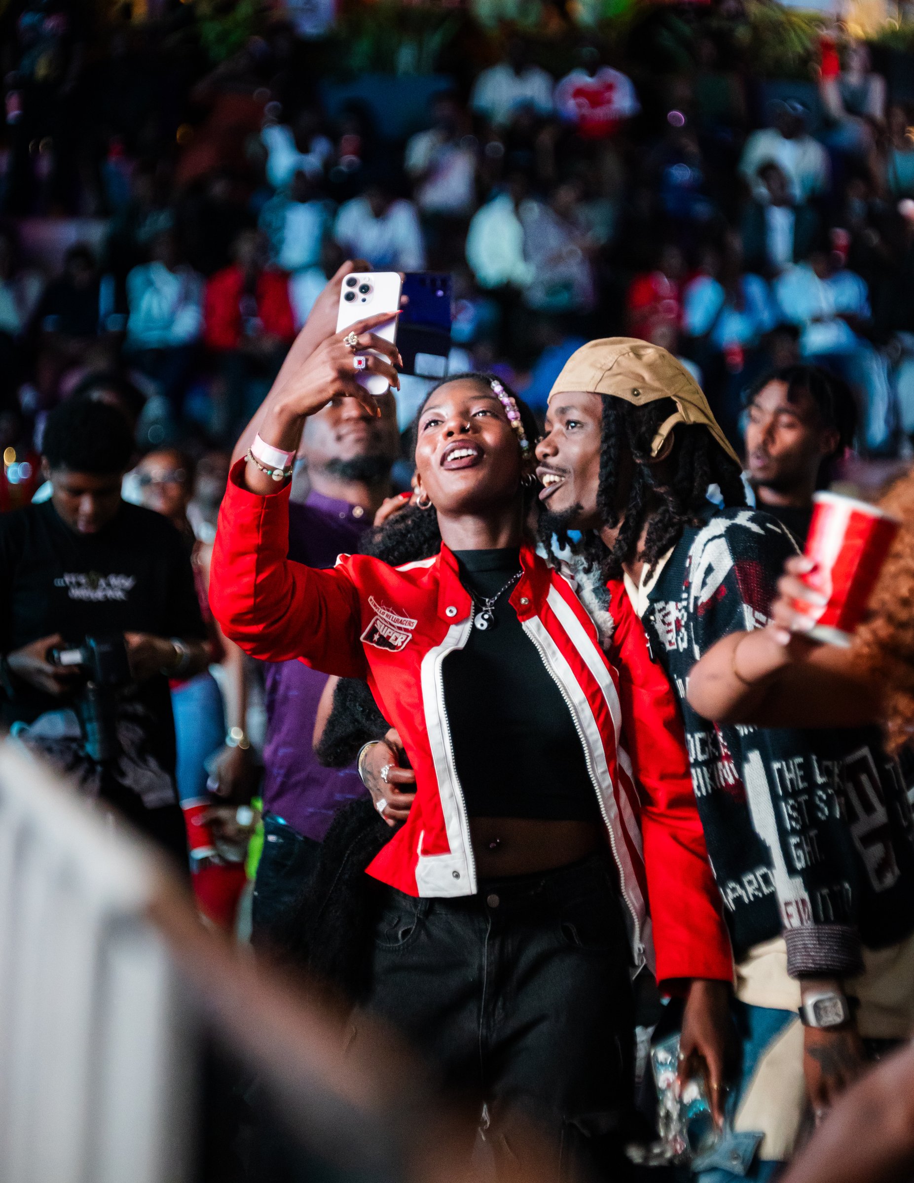 Fans taking a selfie in the crowd at an event at Zaria Court Kigali