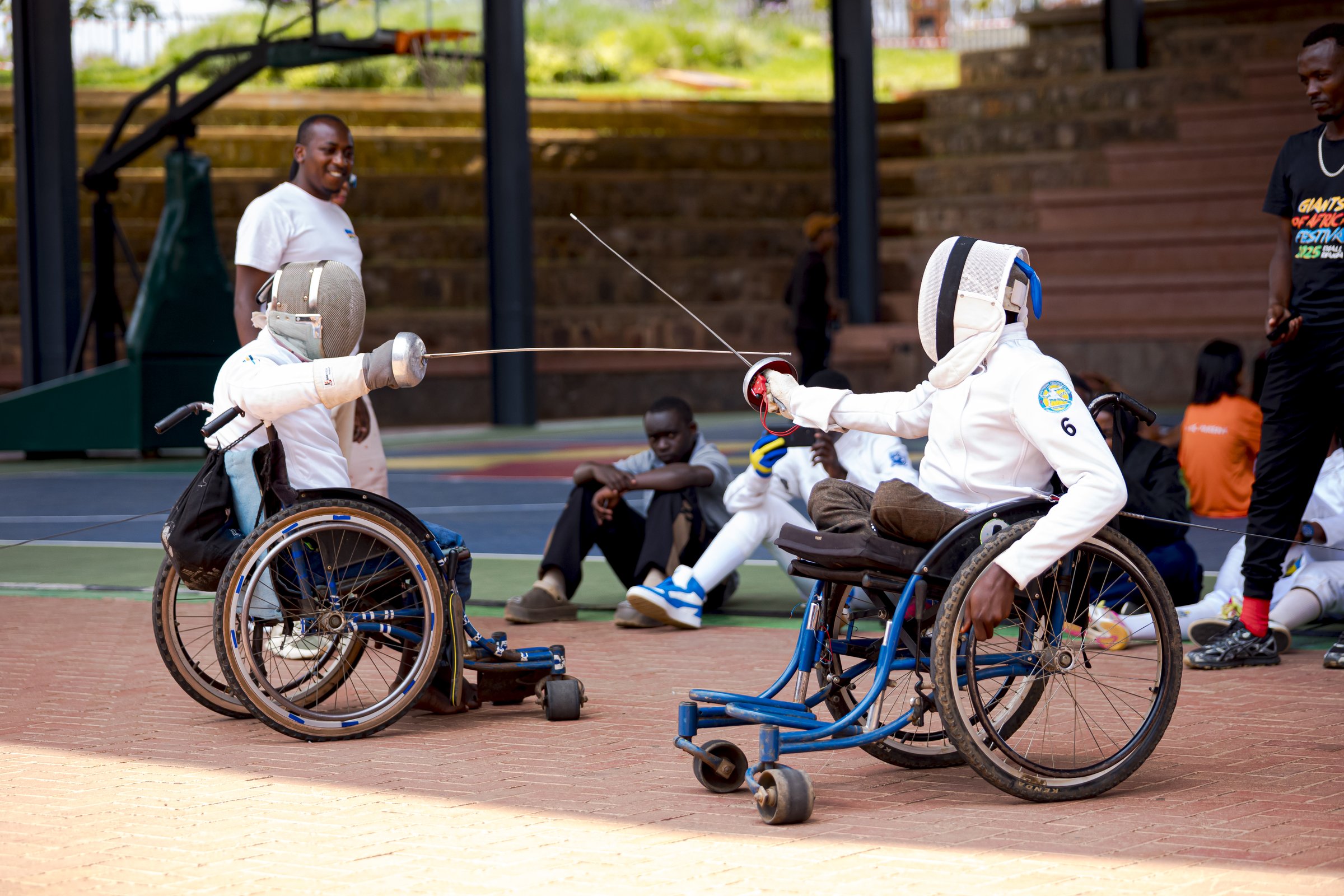 Wheelchair fencers competing on the court at Zaria Court Kigali