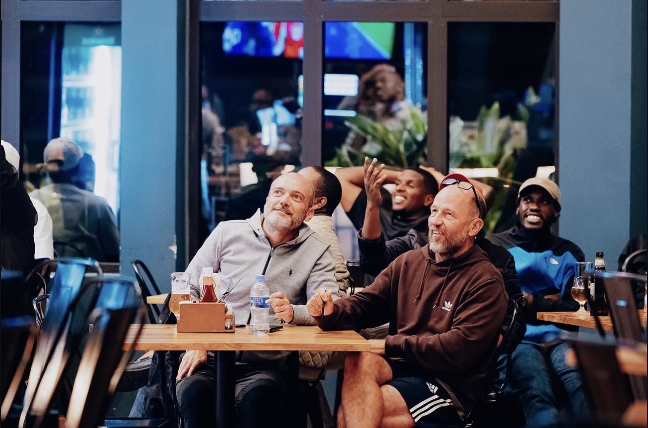 Guests reacting to a match at the sports bar at Zaria Court Kigali