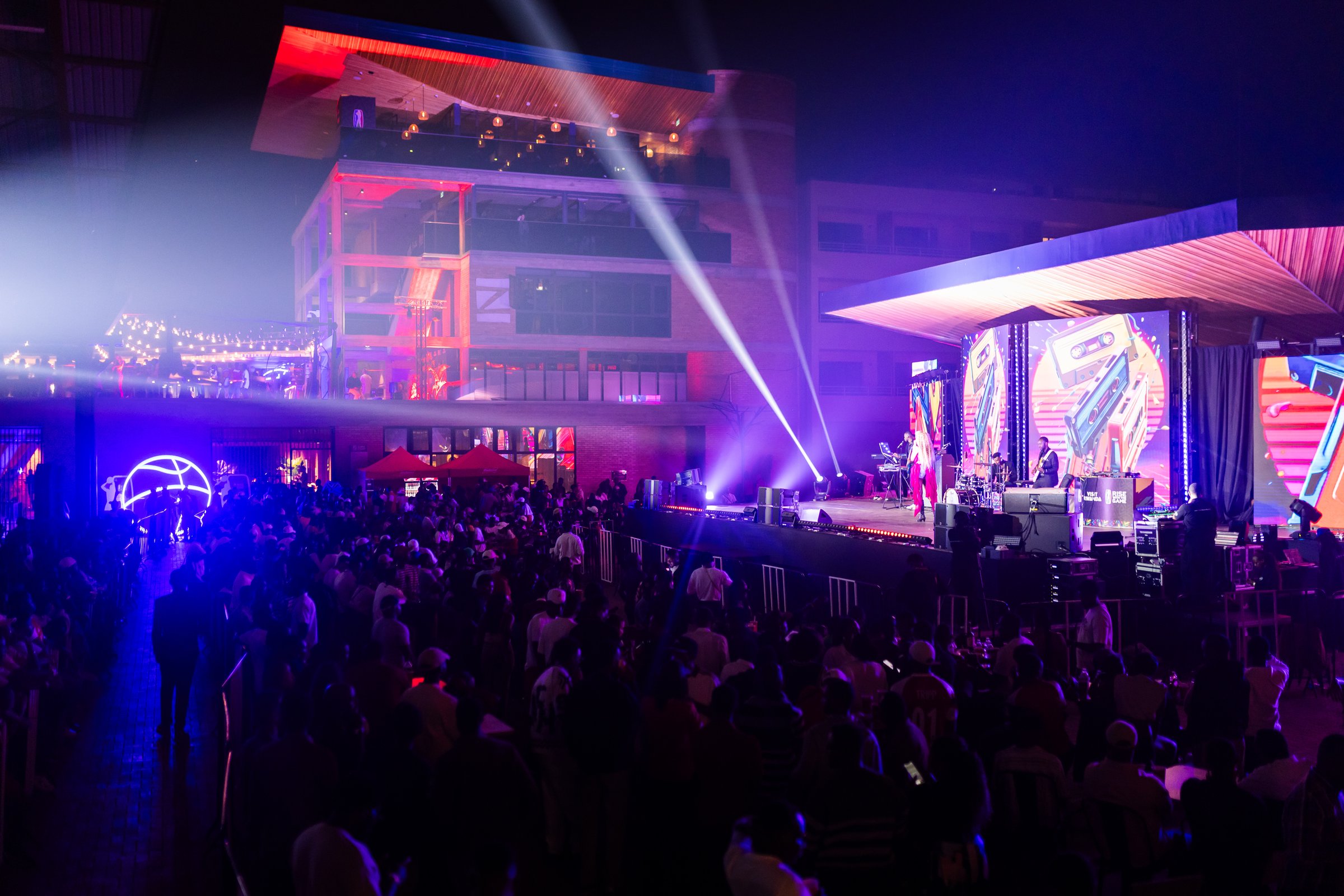 Laser lights and a packed crowd during a concert at Zaria Court Kigali