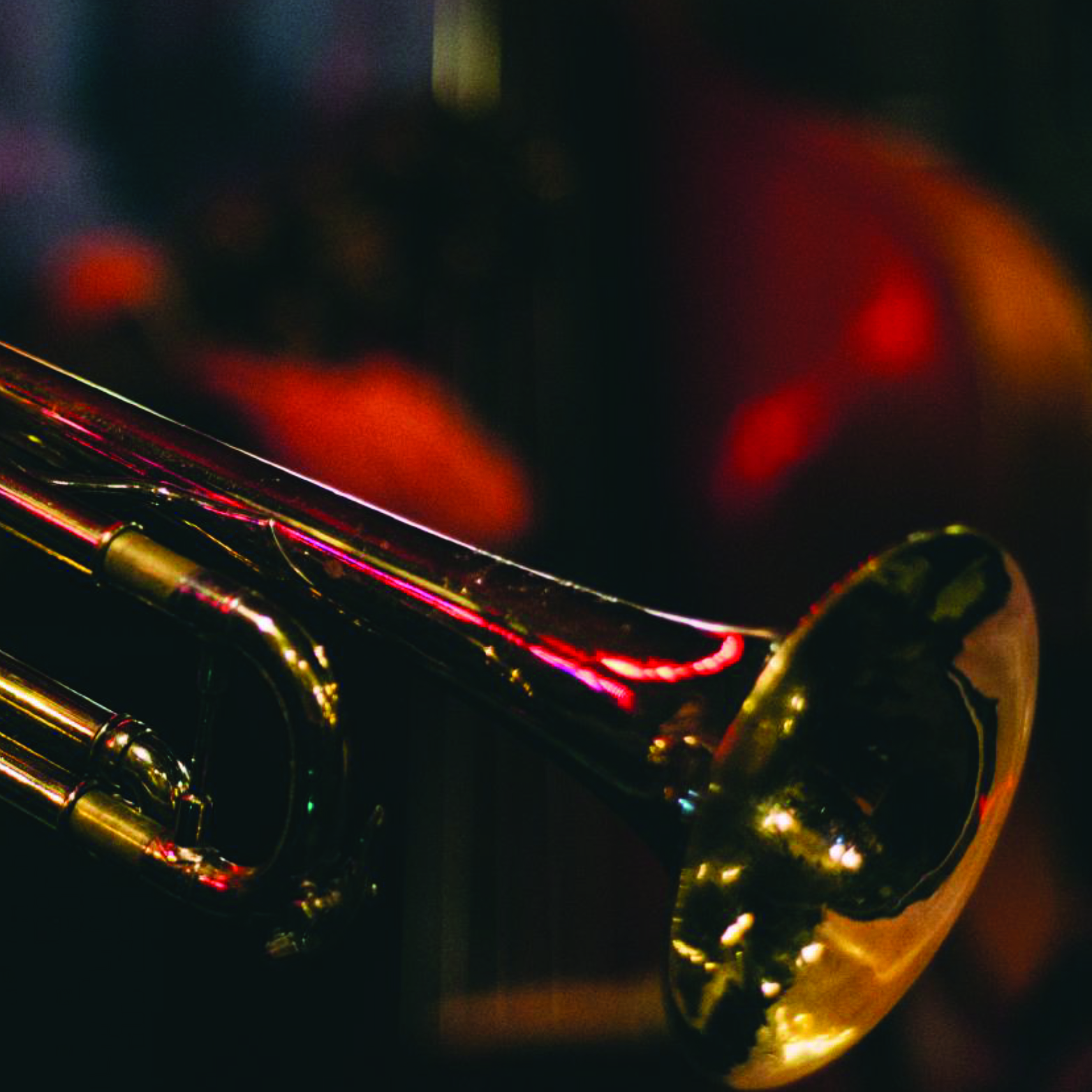 Close-up photograph of a shiny brass trumpet with warm ambient lighting and blurred jazz club background, emphasizing musical elements and atmosphere for the Take 5 jazz lounge branding.
