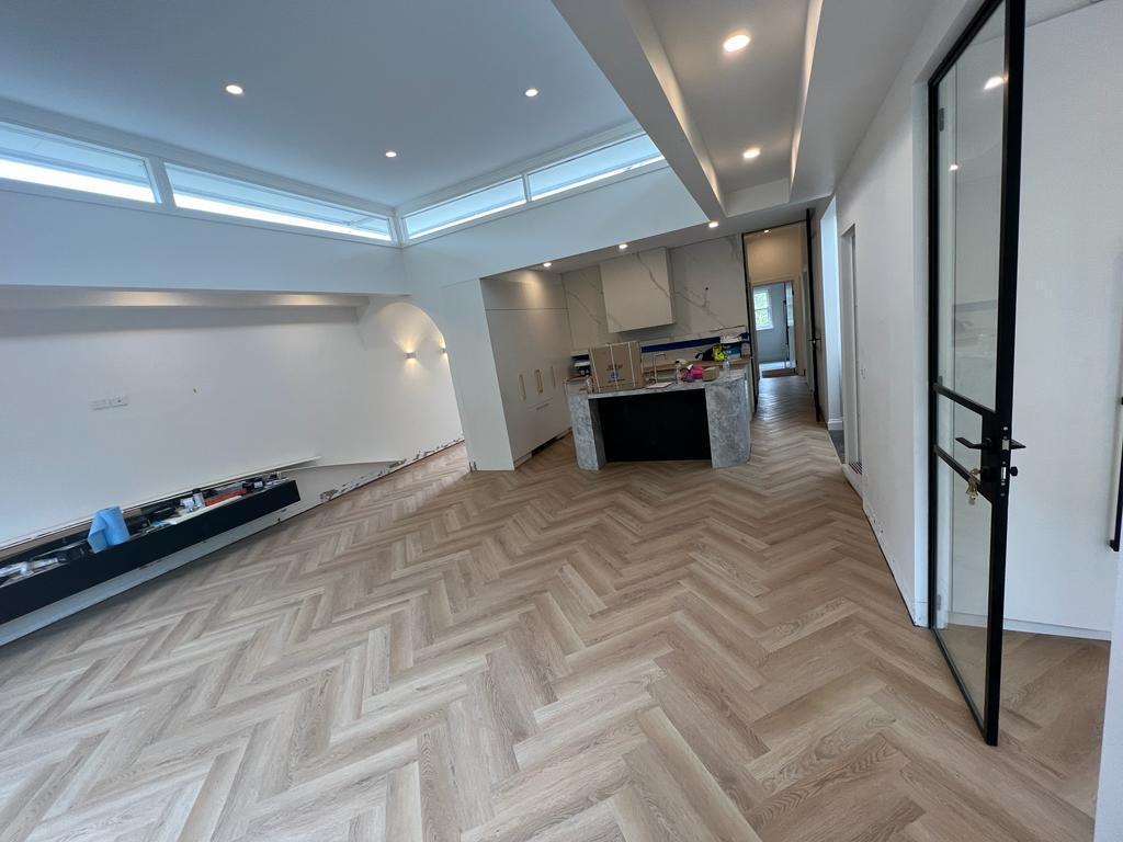 Finished living room flooring with Parchment Oak engineered timber, featuring a soft, light beige wood finish for a warm and elegant space.