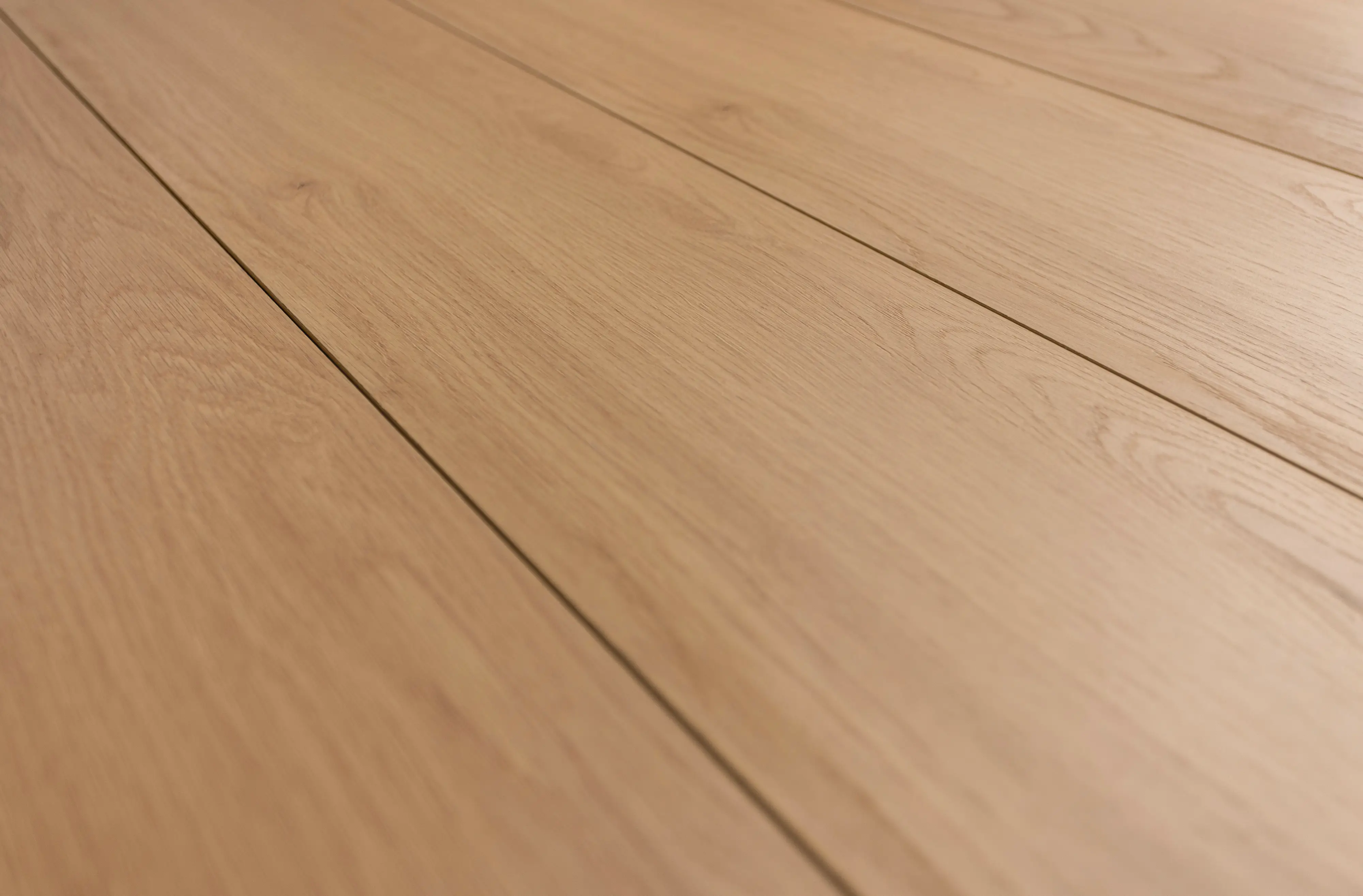 Perspective laminate flooring, code C1202, with a natural oak wood-look finish and subtle grain texture for a warm and modern interior style.