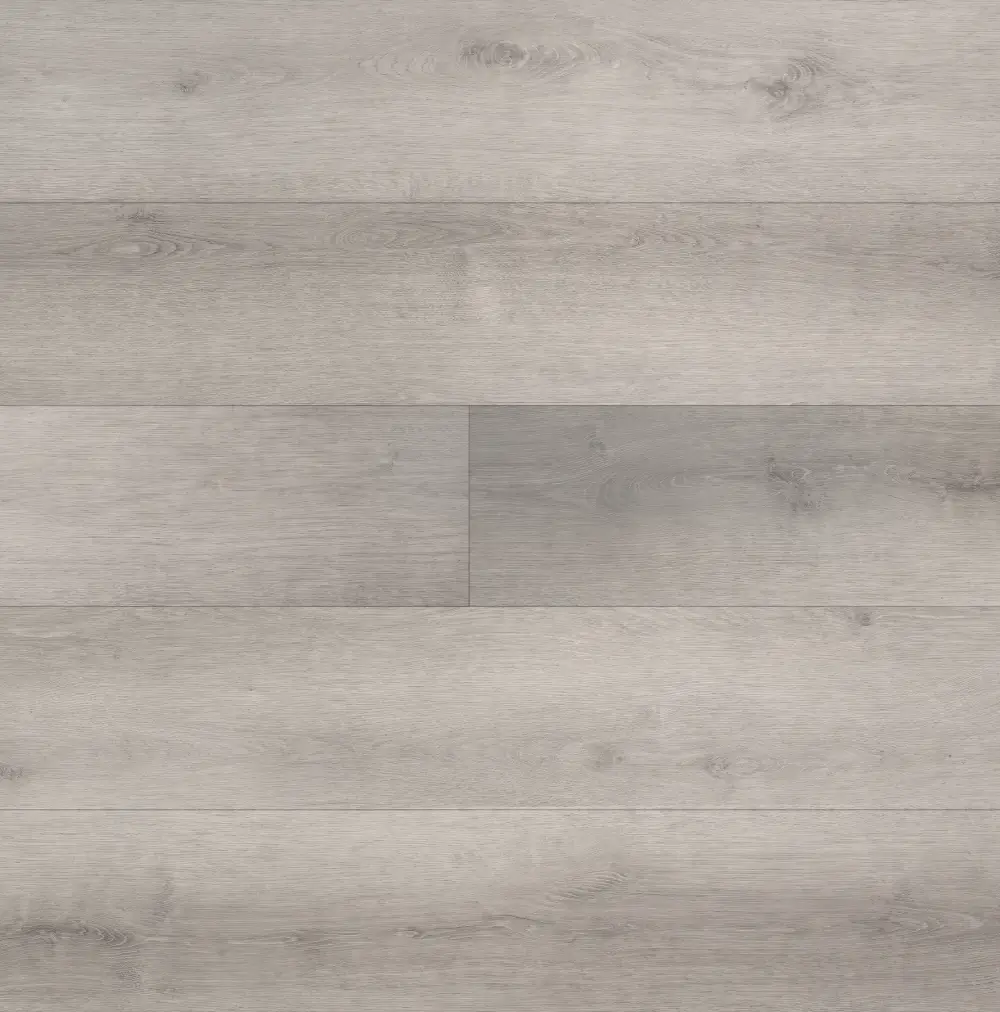 Hybrid flooring in Moonlit Grey model featuring soft grey tones with a smooth, modern finish.