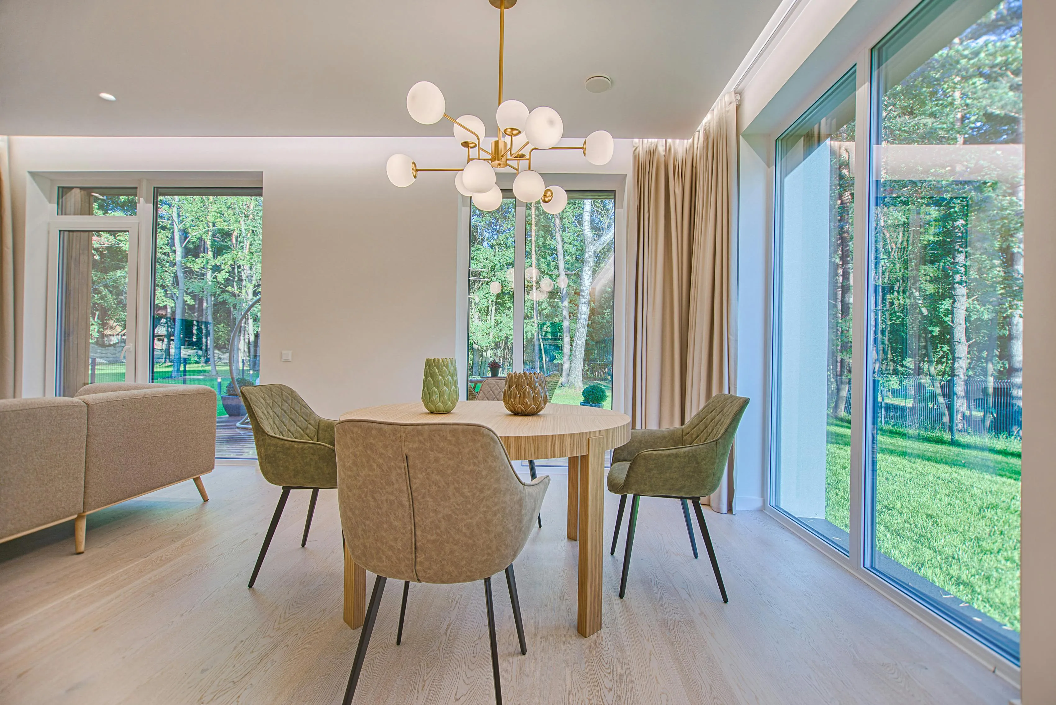 Dining room with finished light oak engineered timber flooring, showcasing smooth golden tones and natural wood grain, creating a warm and elegant atmosphere.