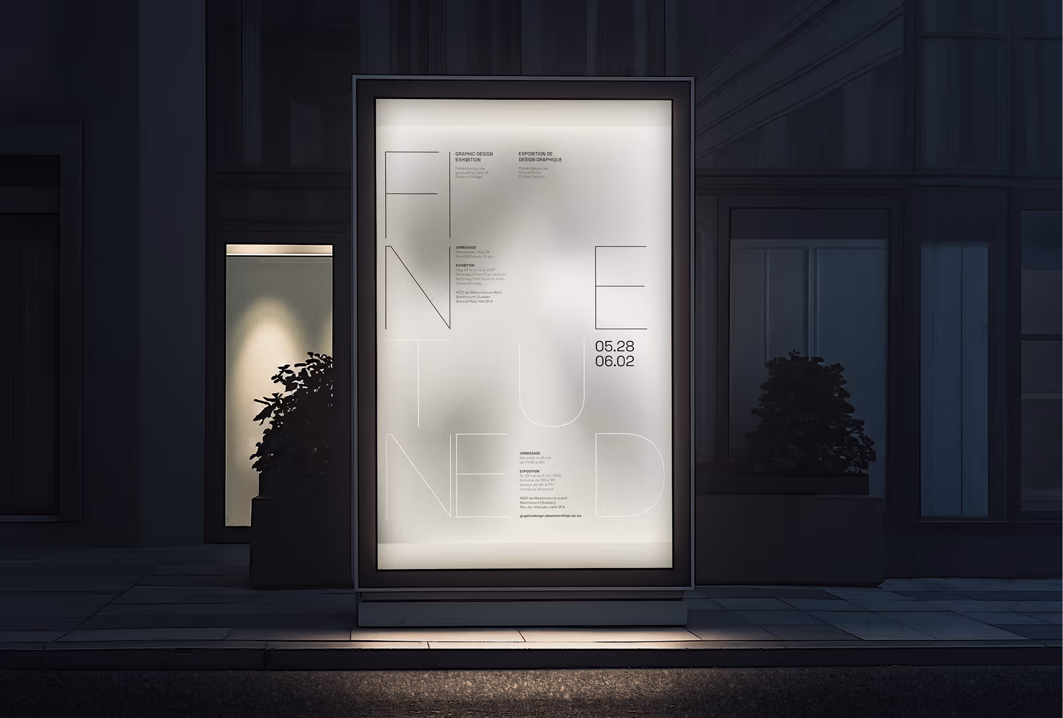 The poster in a light box outside at night.