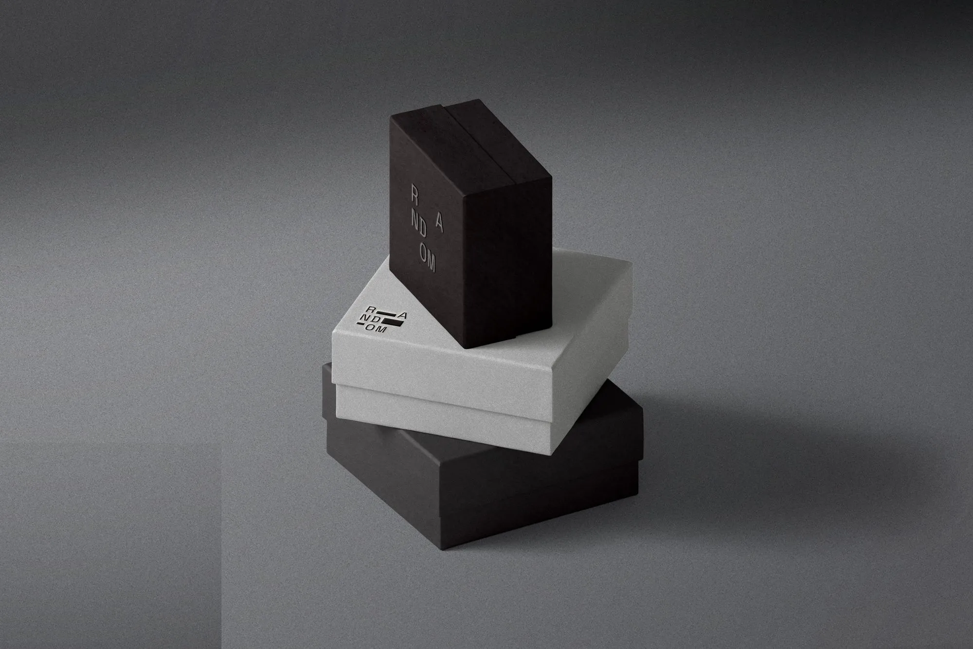 Image of three small packaging boxes stacked.