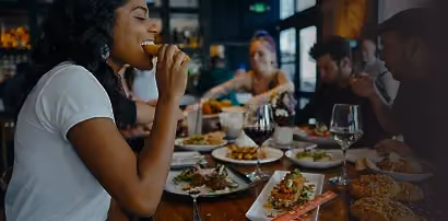 Friends sharing a meal at a restaurant