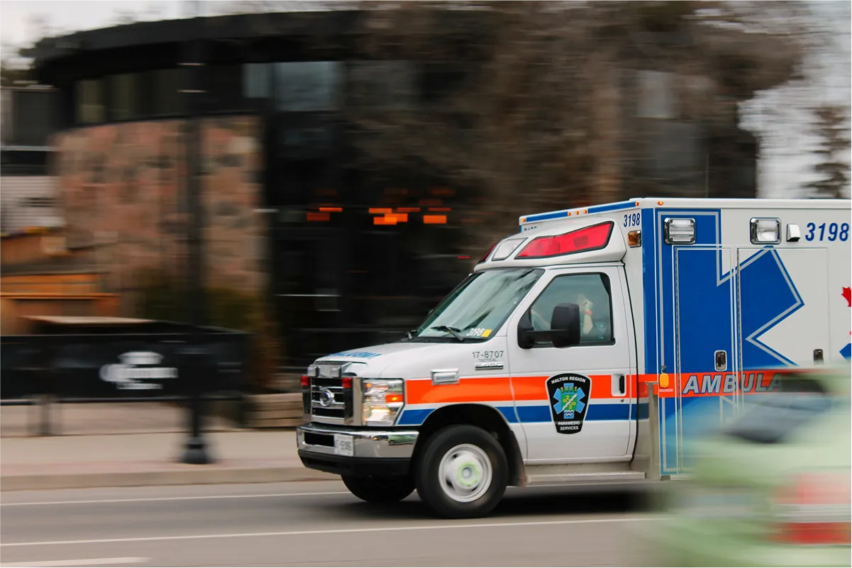 Ambulance driving down a city street