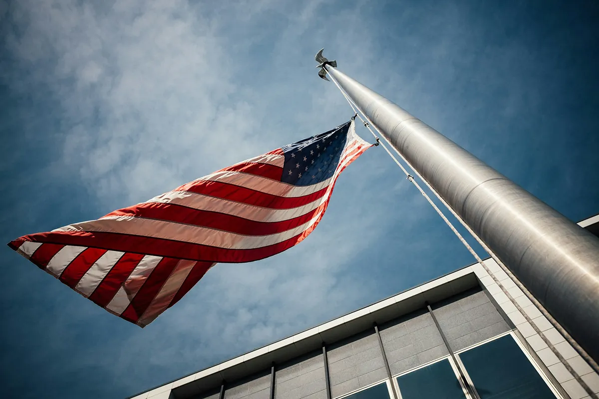 American flag flying against a blue sky