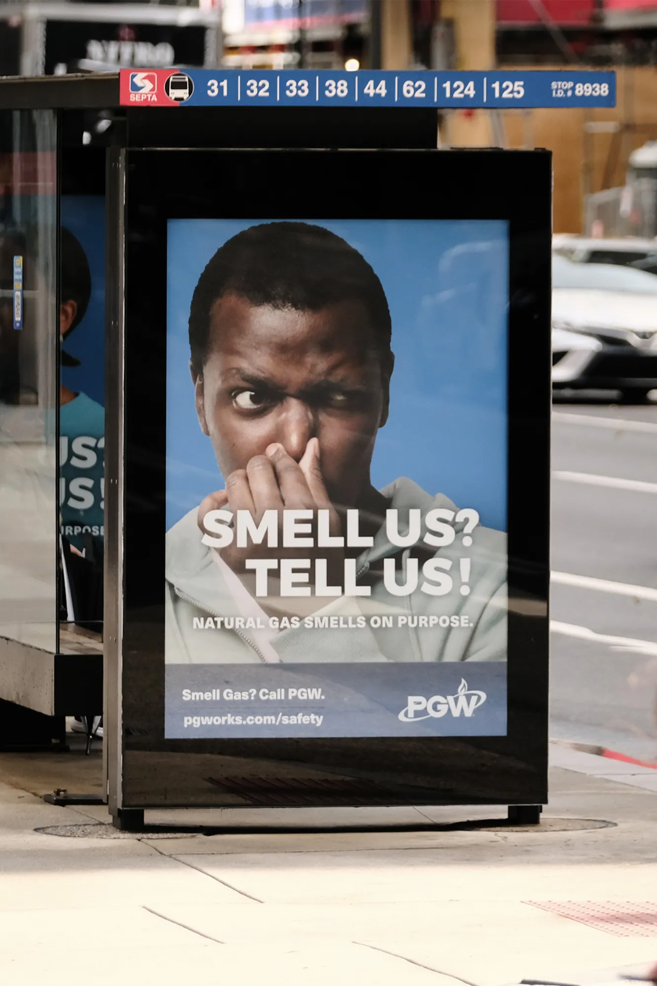 Bus shelter poster ad on a city street