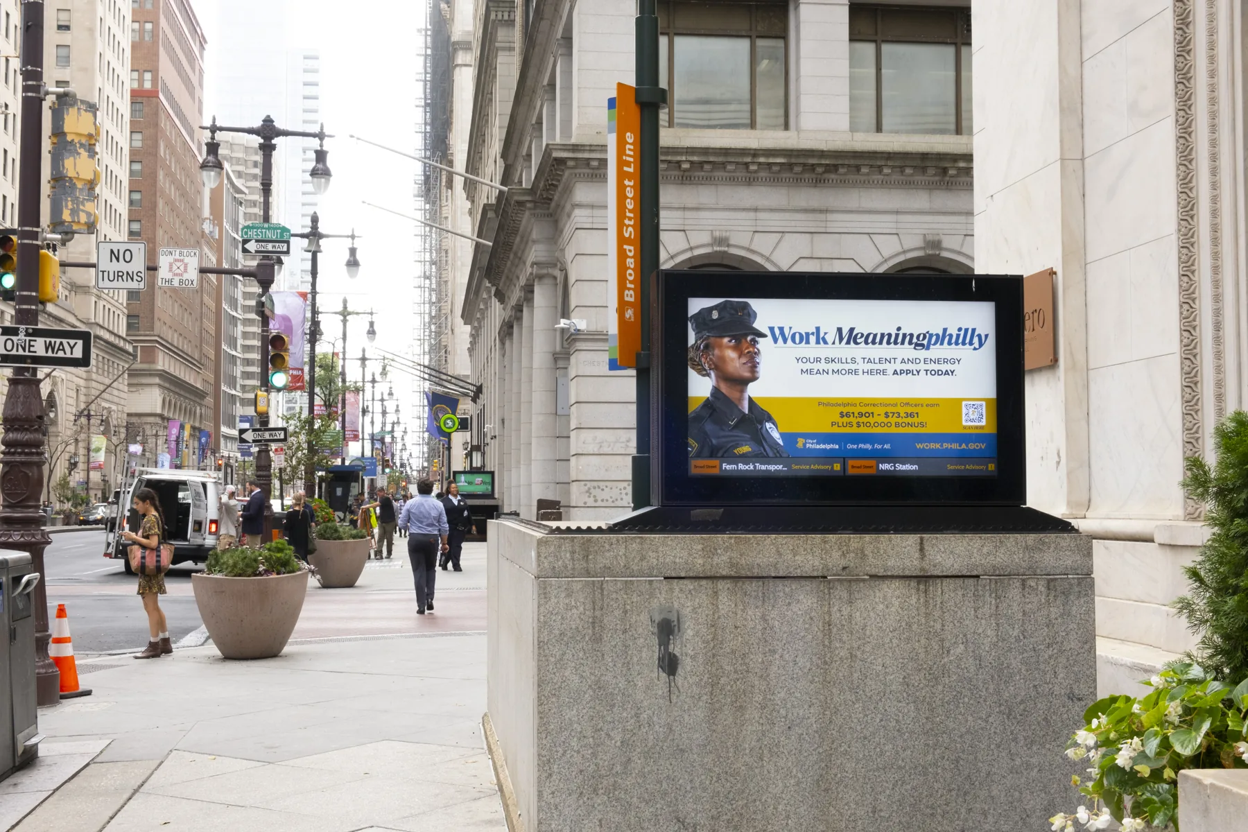 Digital kiosk ad on a city sidewalk
