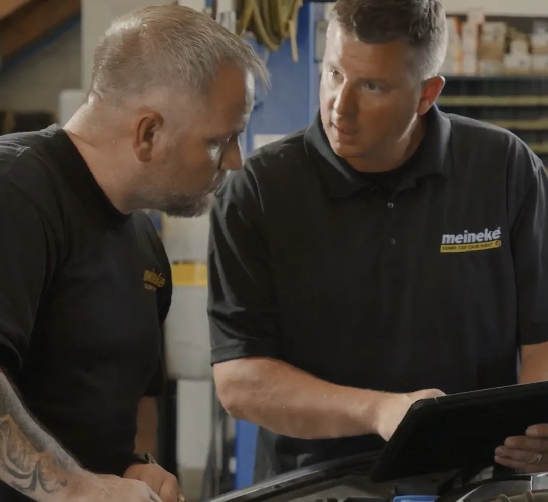 Meineke team reviewing footage during a commercial shoot