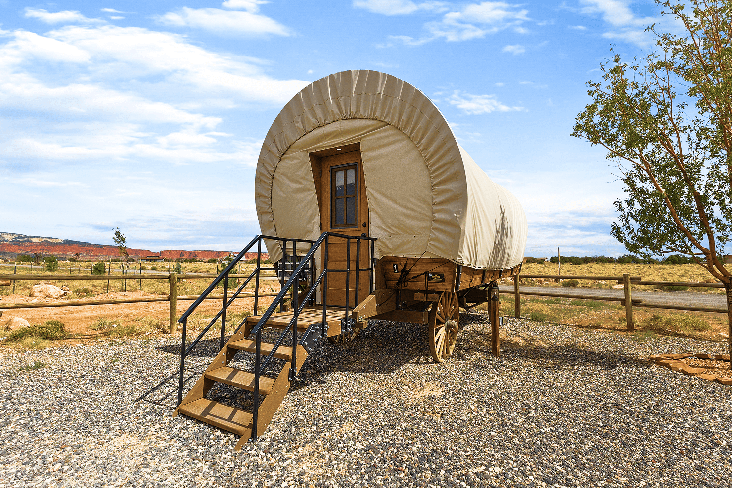 Family-friendly Conestoga wagon with king bed and bunks—glamping near Capitol Reef National Park.