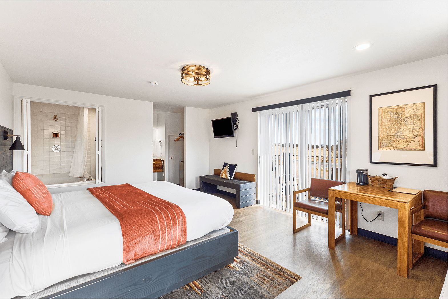Room with balcony and red rock view—hotel near Capitol Reef National Park.
