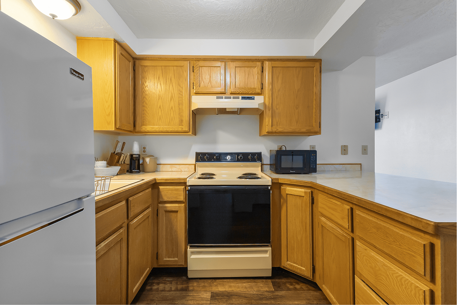 In-room kitchen with full appliances at Broken Spur Inn & Steakhouse in Torrey Utah