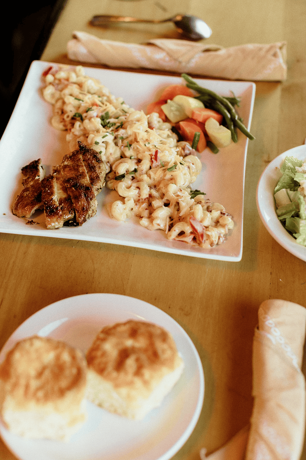 Mac and cheese entrée with grilled chicken at Broken Spur Inn & Steakhouse