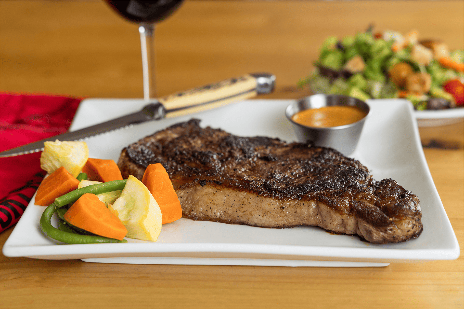 Sirloin steak with sides at Broken Spur Steakhouse—best restaurants in Torrey, Utah.
