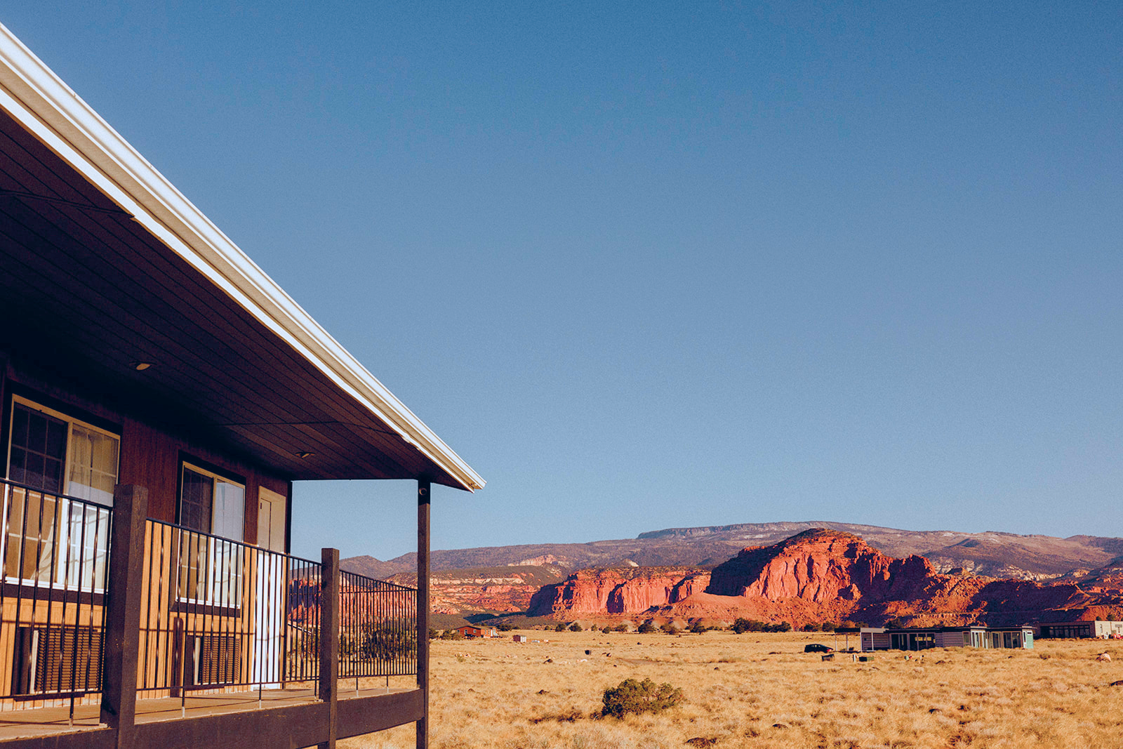 View of red rock cliffs from the Broken Spur Inn near Capitol Reef National Park