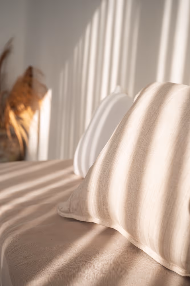 Soft cushions and natural decor at Villa Kasih