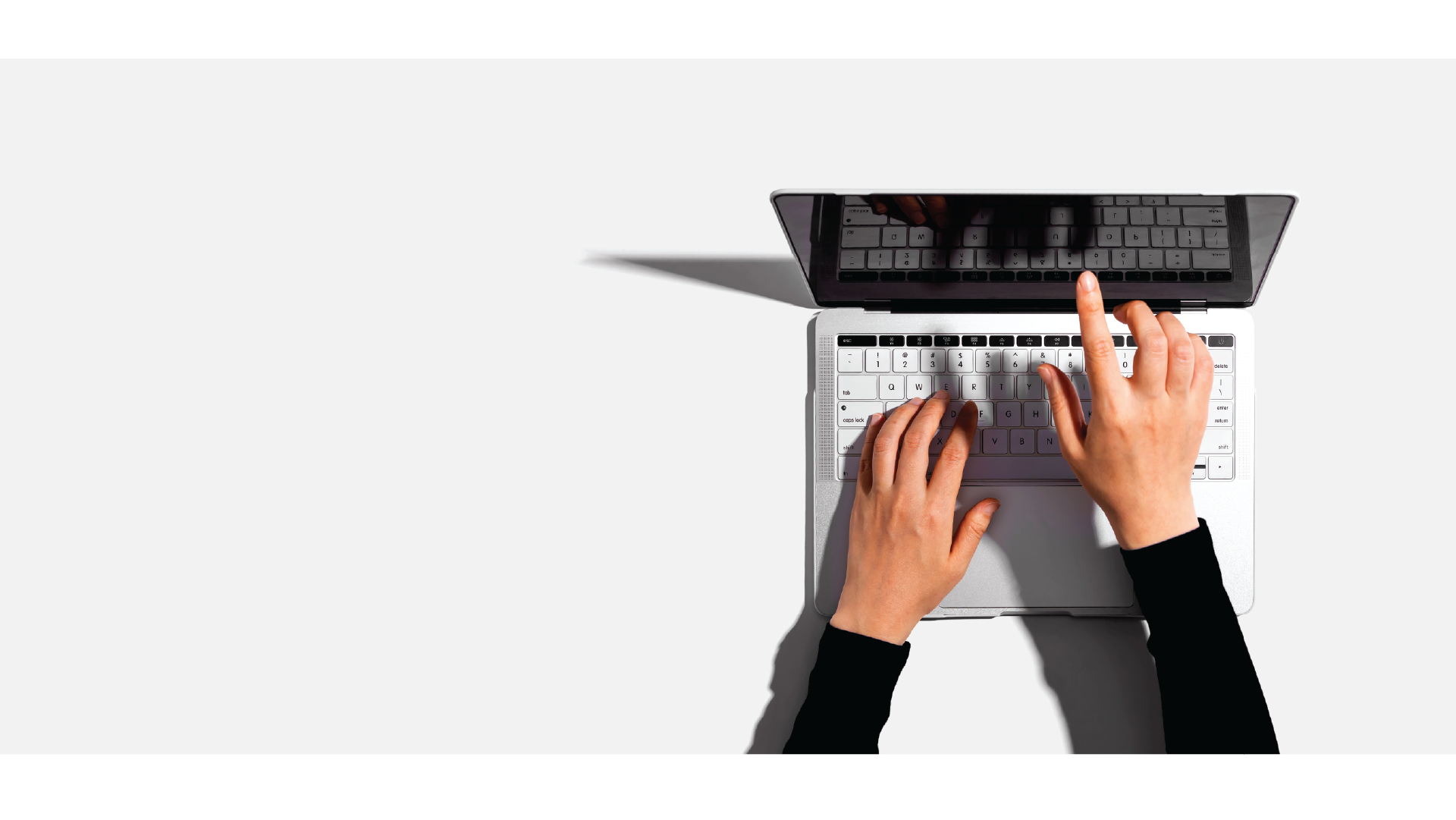 Laptop with hands typing