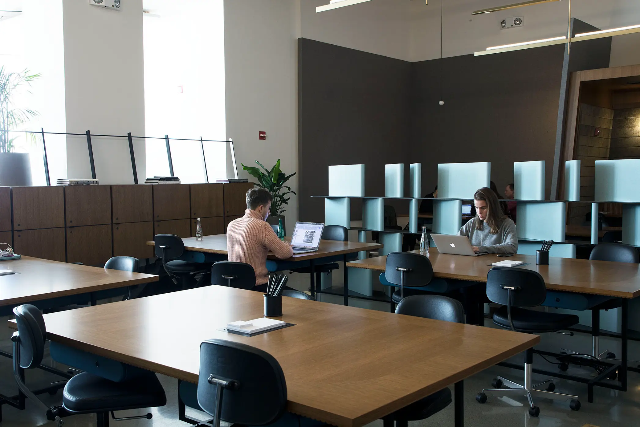 Spacious open-plan desks with safekeeping armoires at Spring Place for daily work