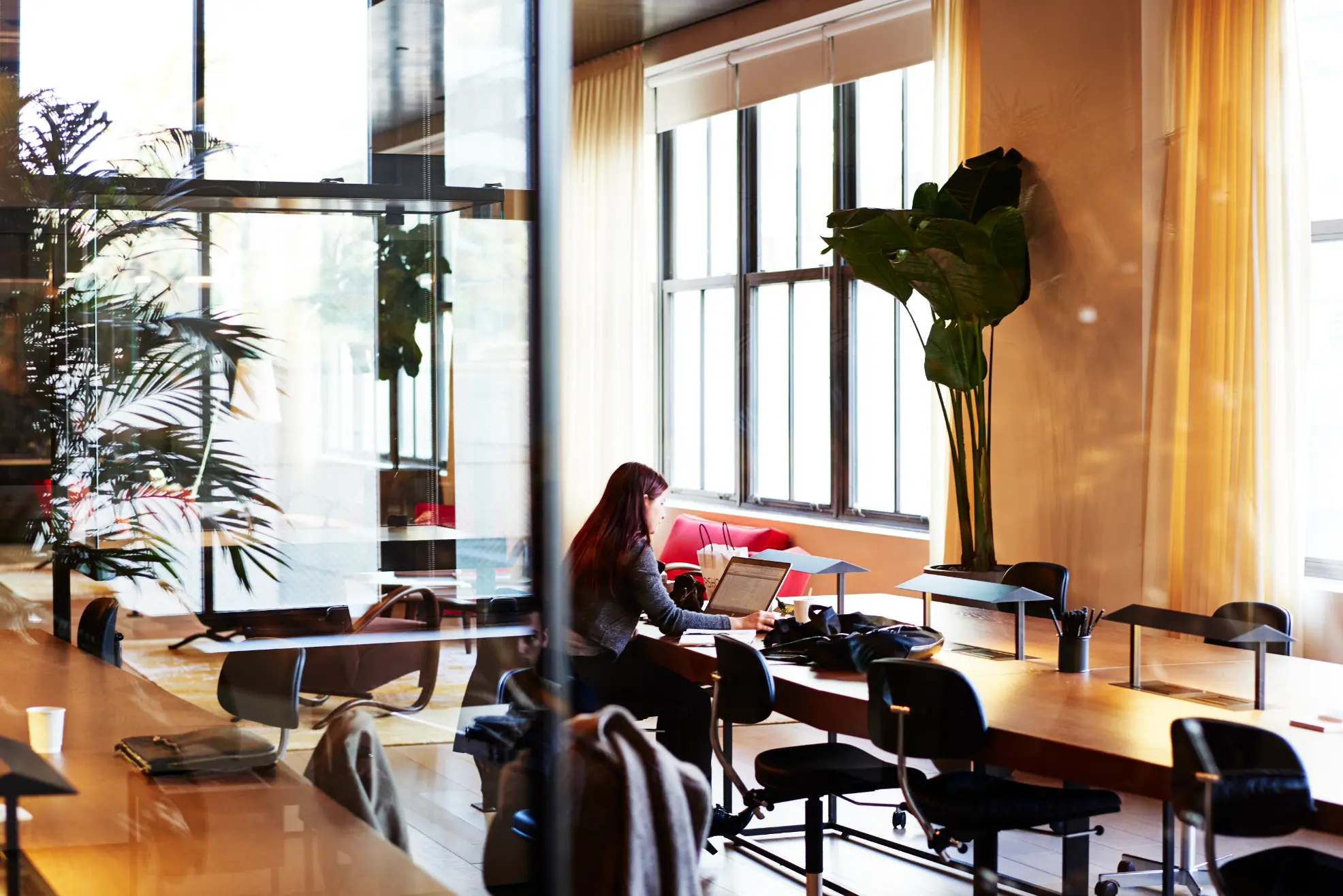 Elegant coworking area at Spring Place with desks, art displays, and private storage