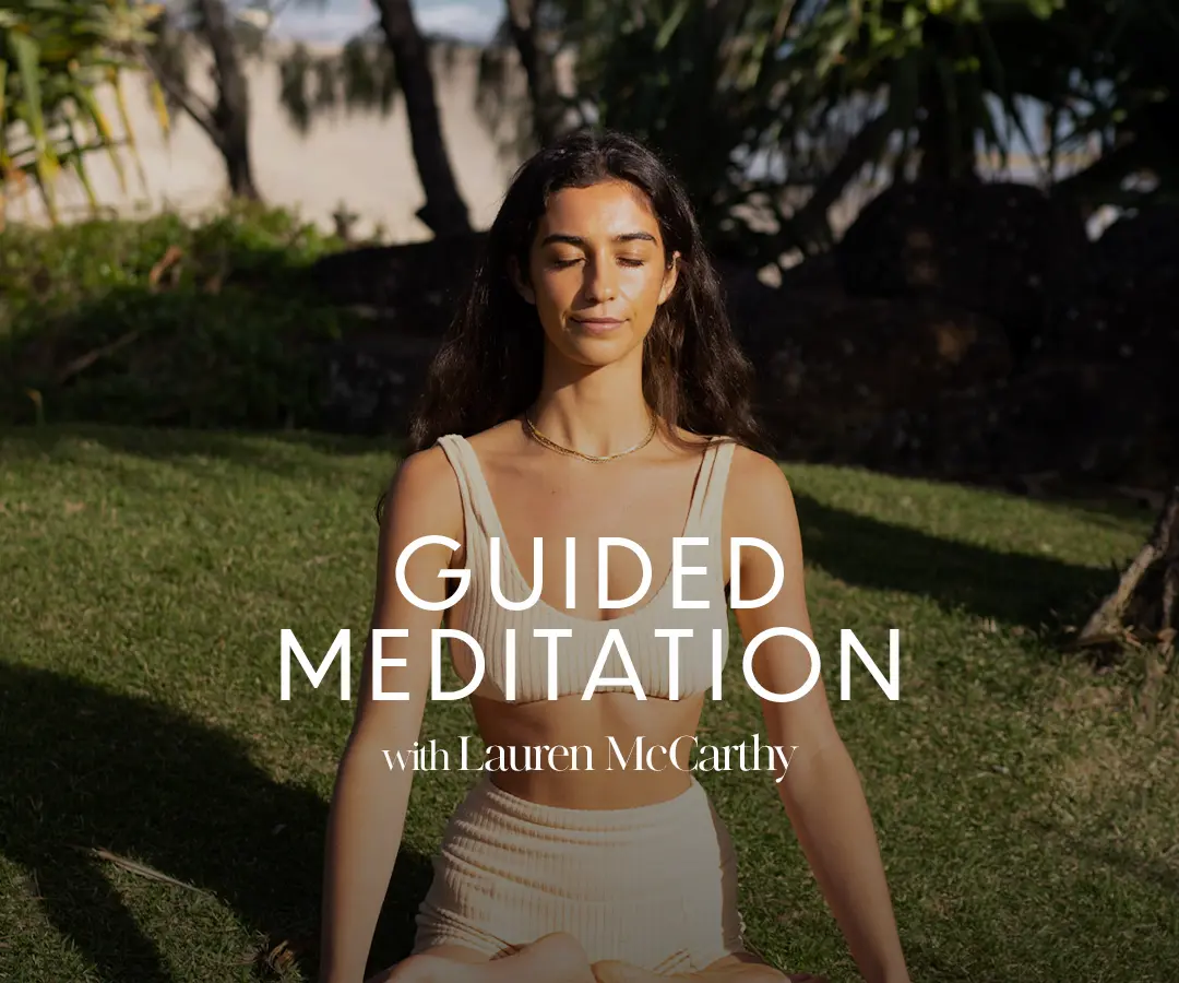 "Guided Meditation with Lauren McCarthy" written on top of an image of woman meditating on grass