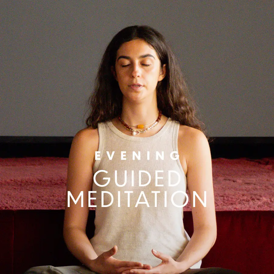 "Guided Meditation with Lauren McCarthy" written on top of an image of woman meditating