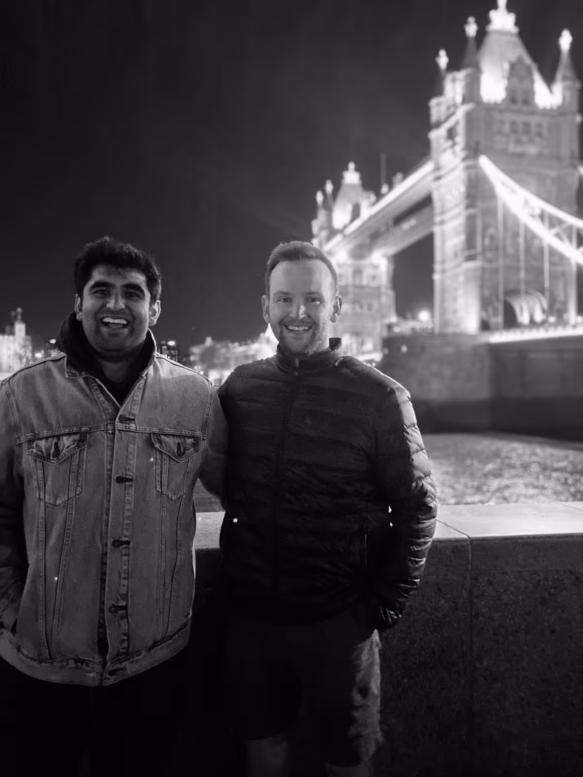 A photograph of Project Voxel's founders, Maadhav Kothari and Hamish Haddow standing in front of Tower Bridge in London