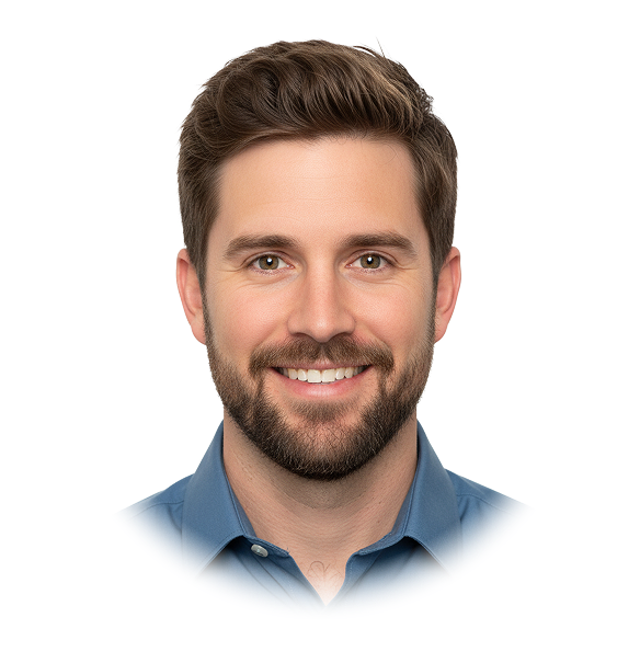 Smiling man with short brown hair and beard wearing a blue collared shirt.