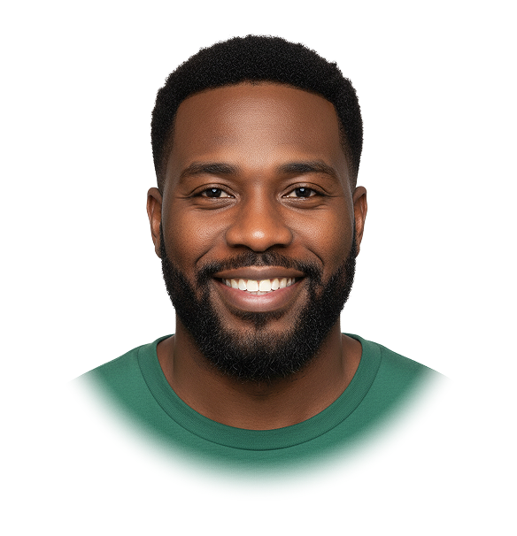 Smiling African American man with short curly hair and beard wearing a green shirt.