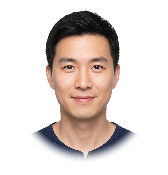 Smiling young Asian man with short black hair wearing a dark blue shirt.