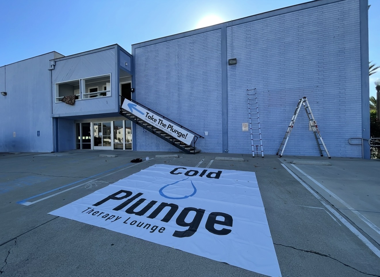 The original Cold Plunge Therapy Lounge signage before Plunge Performance