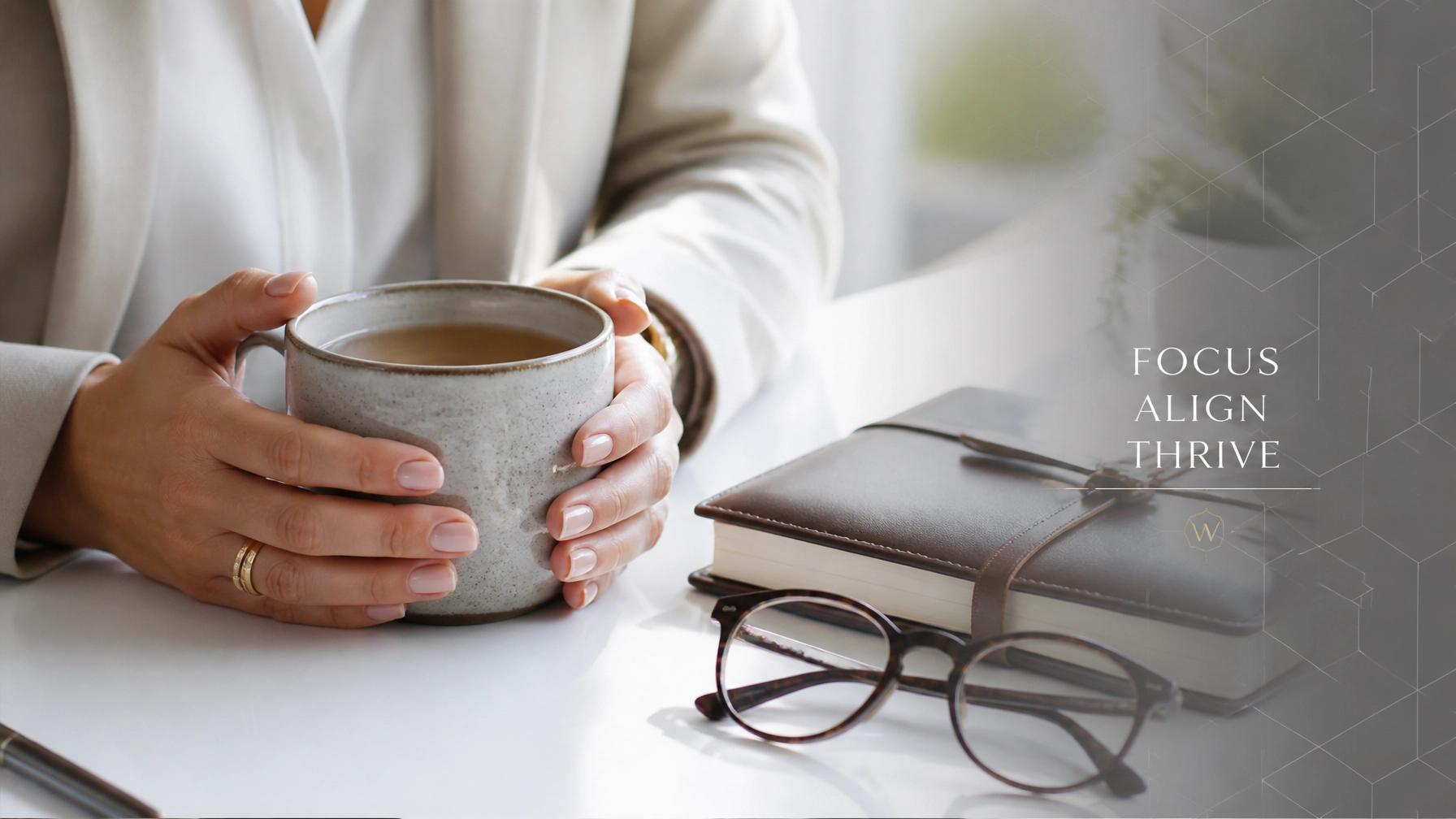Calm professional desk setting with mug and journal