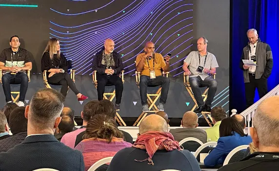 Photo from the crowd in a event with people on stage
