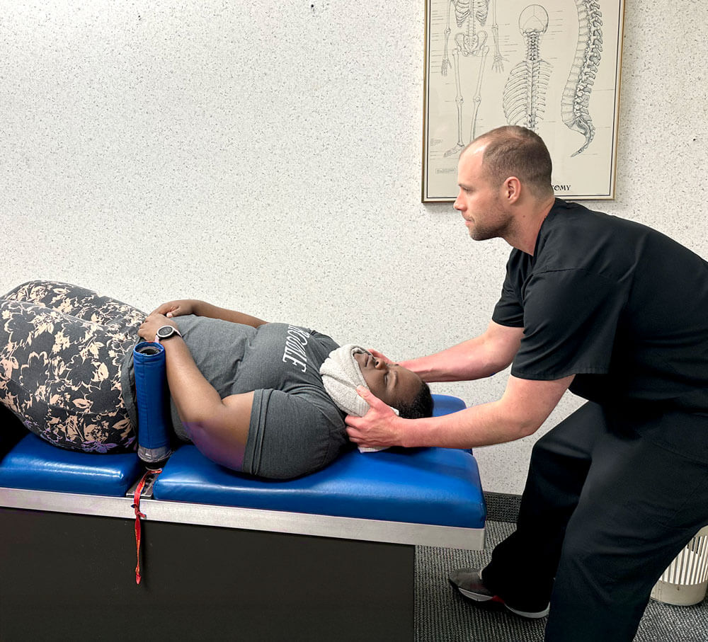 woman gets relief with manual spinal decompression