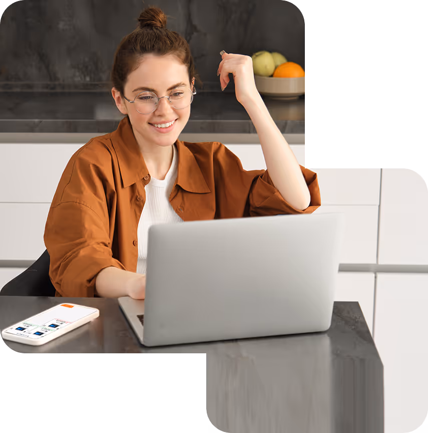 A person sits at a desk using a laptop with their smartphone next to them showing the Credenti Now app. The image illustrates passwordless workstation unlock for knowledge workers. Credenti Now also detects when the user walks away with their phone and automatically secures the workstation based on BLE proximity.