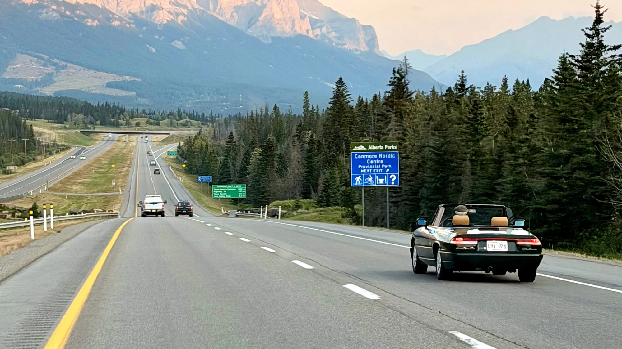 The drive into Canmore on a Friday afternoon, the Three Sisters lit ahead