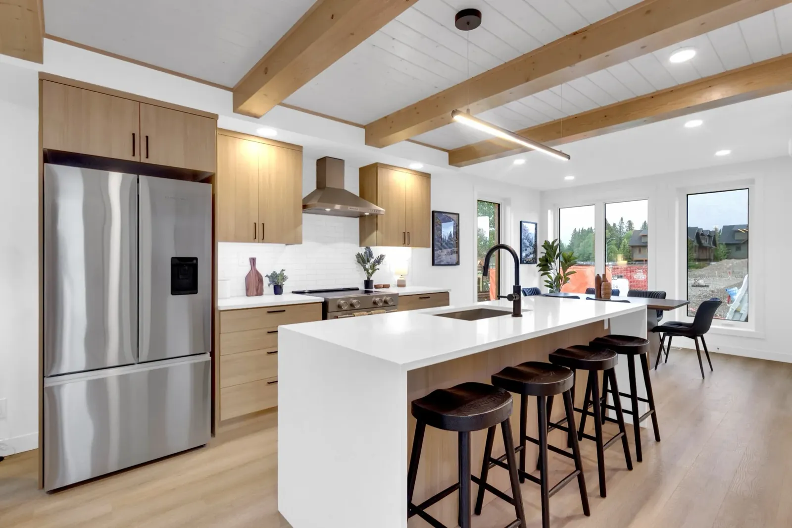 The kitchen and island of an upper three-bedroom home at Colliery Parc in South Canmore