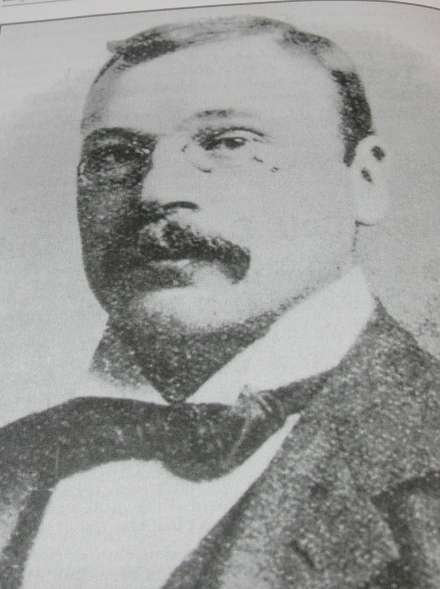 Headshot of golf course architect NAME, designer of notable courses and featured biography