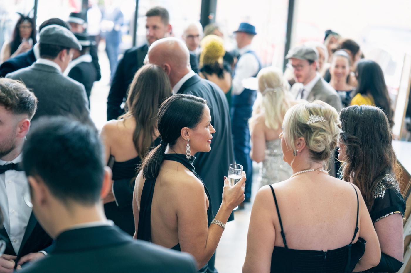 Guests networking over drinks at a Blue Bricks event