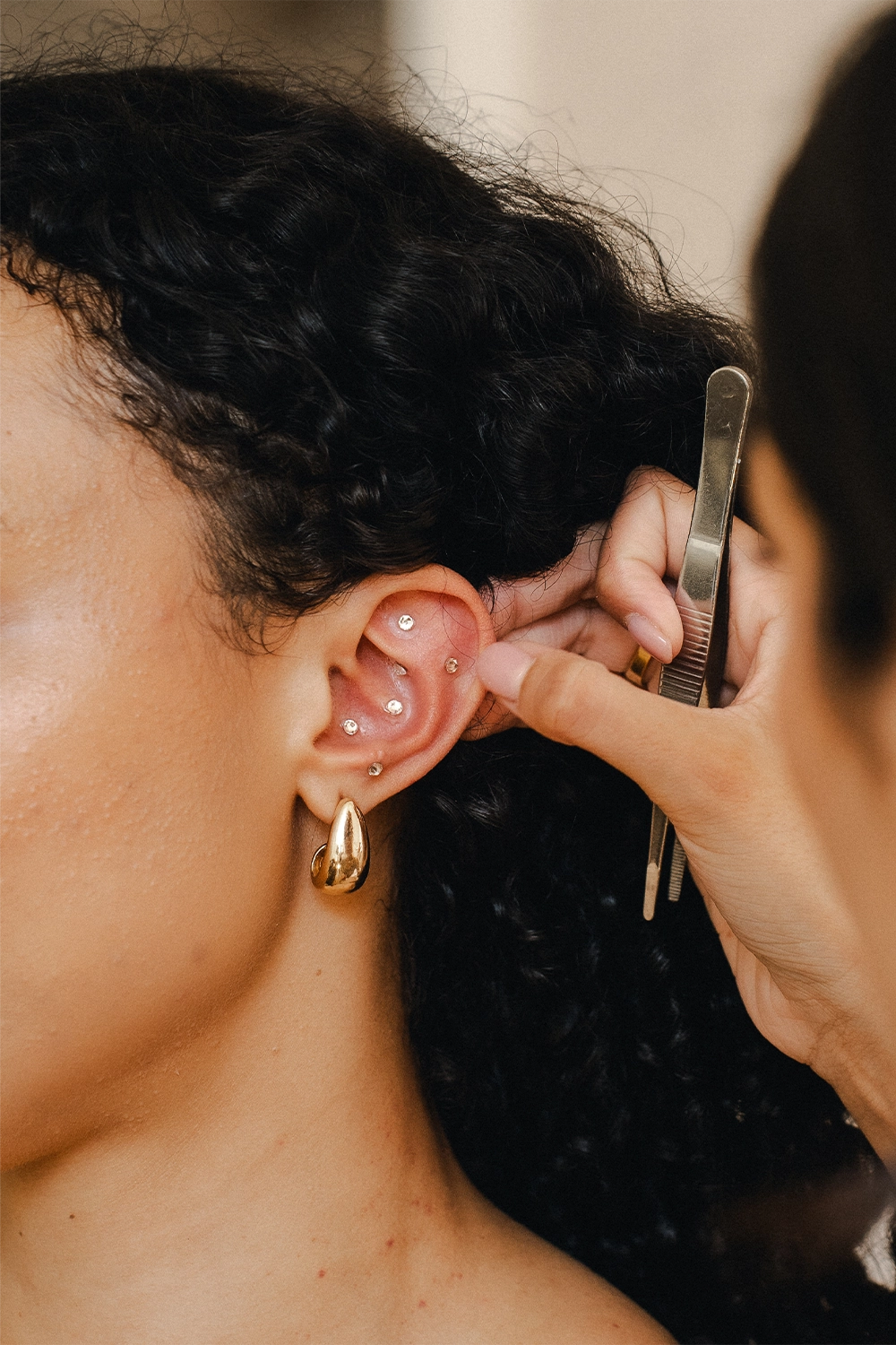 a woman with ear piercings