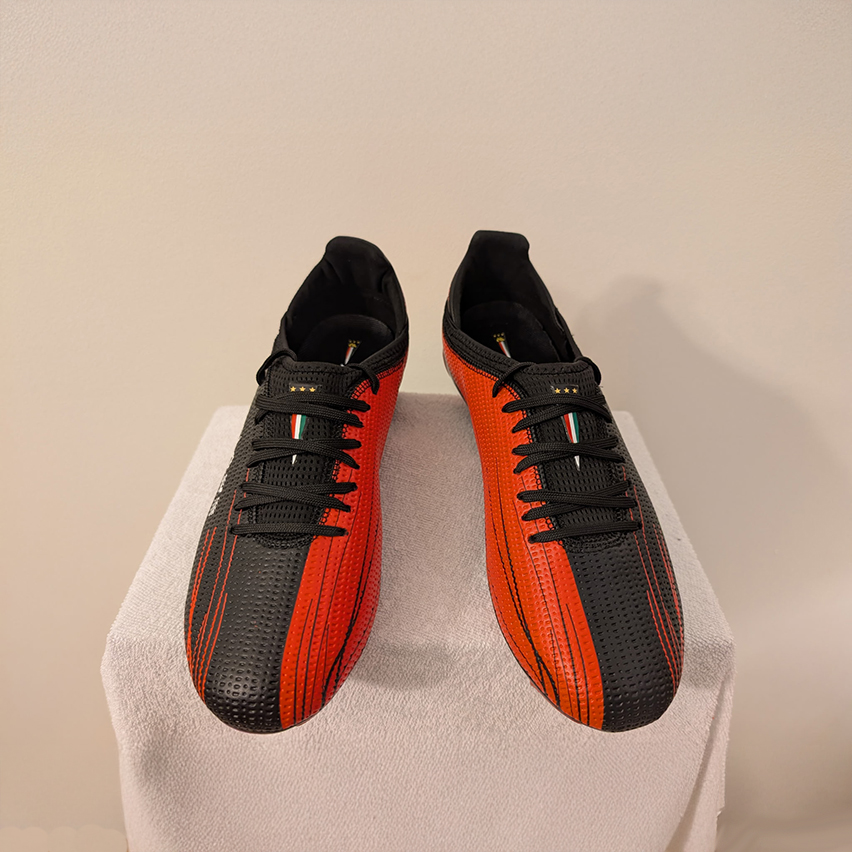 Front and top angle of the black and orange Avtiare Velocita Shoes