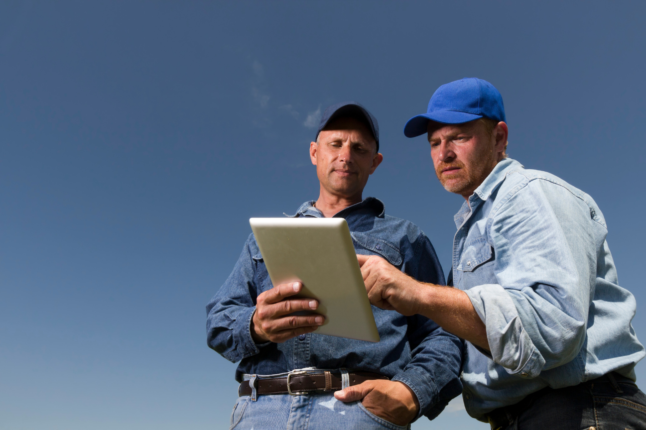 HVAC co-founders reviewing data on-site, reflecting which field metrics actually drive margin, not just track busywork.
