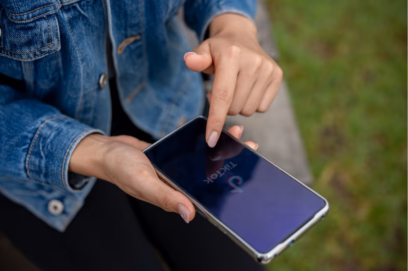 Close-up of HVAC operator pointing to a smartphone, highlighting wasted ad spend across lead sources.