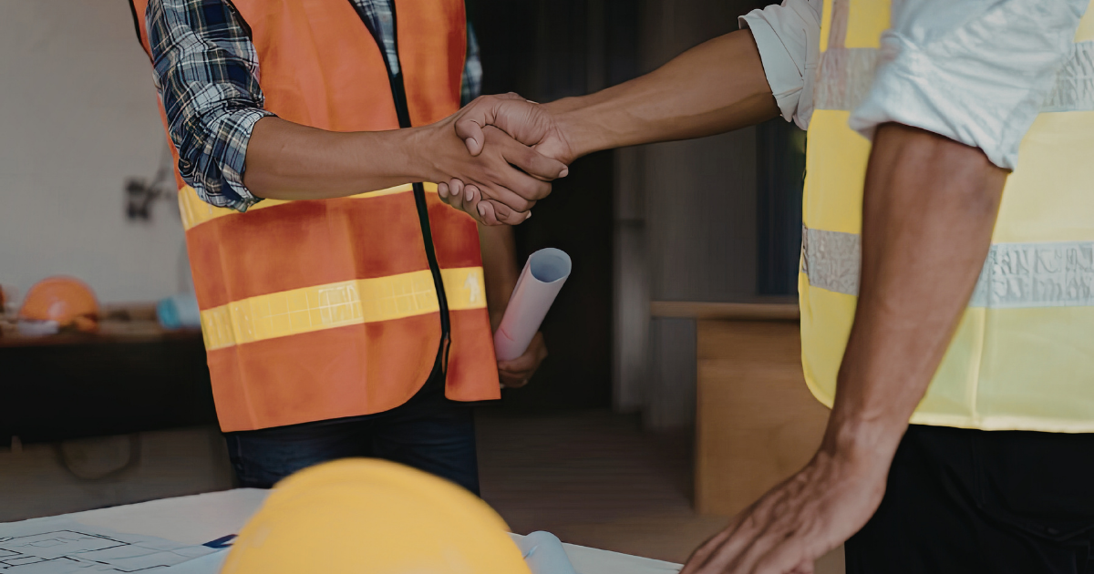 Pair of worn work boots on grass, symbolizing the legacy of an HVAC owner building a lasting business to pass on to their child.