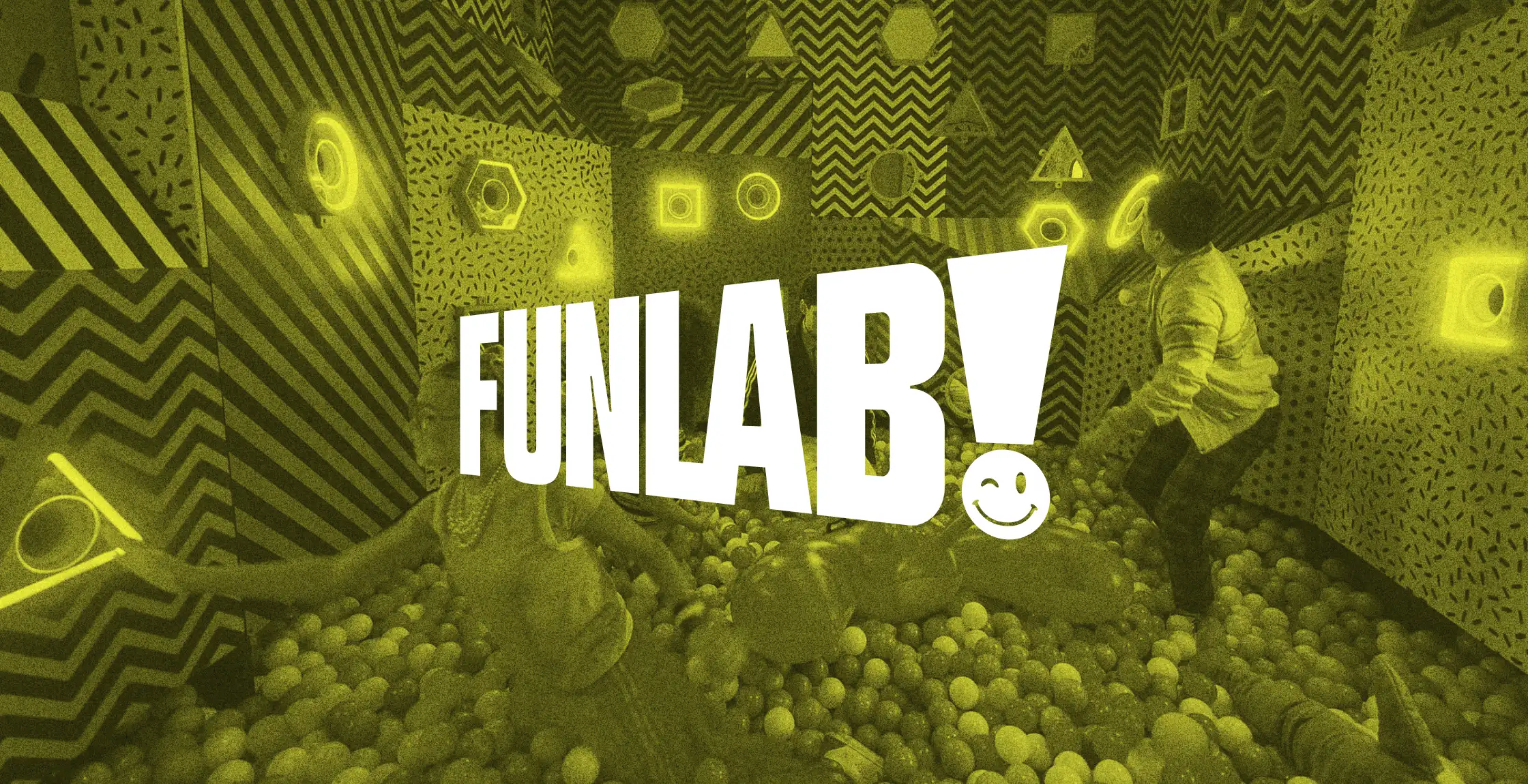 Funlab logo over a yellow-tinted photo of a person in a colourful neon play space with a ball pit