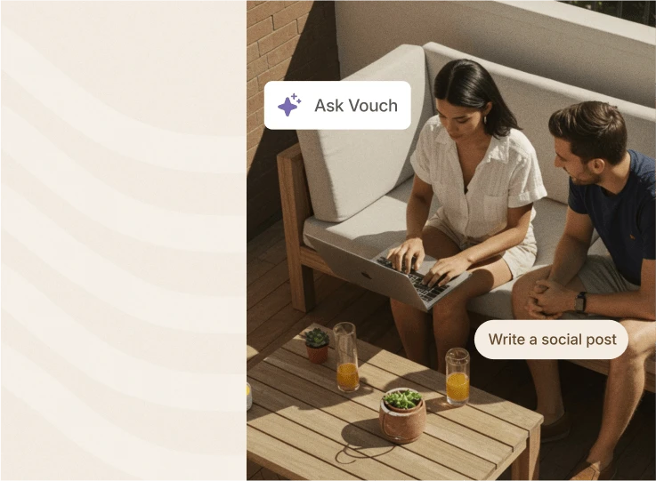 Two people working on a laptop on a sofa with Vouch 'Ask Vouch' and 'Write a social post' prompts